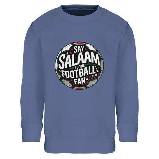 Say Salaam to the Football Fan Design #1 Part-Recycled Cotton-Poly Kids Sweatshirt – Blue / Denim Blue. Youth Islamic football sweatshirt showcasing a round football badge graphic with layered typography across a dark pitch-inspired centre. The circular crest combines black, green and white contrasts with soft red highlights and subtle stadium glow. Balanced and symmetrical, the emblem mirrors traditional club logos while carrying a confident, energetic tone for young Muslim football fans.