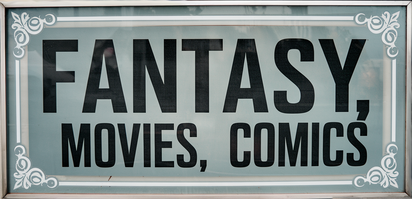 Say Salaam Clothing's Fantasy, Movies, Comics category banner with bold black lettering on a metallic, silver-bordered background. For fans of manga, superheroes, sci-fi, and films, this collection offers bold and stylish creativity.