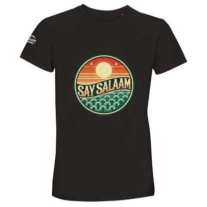 Say Salaam Sunset Glow 50% Recycled Unisex Cotton T-Shirt in Deep Black, a rich jet black shade similar to Zeus black with bold depth. The colourful circular sunset badge stands out sharply against the dark base, combining orange dusk tones and teal ocean-inspired detailing. Constructed from 100% cotton incorporating 50% recycled cotton fibres for comfort and sustainability. A relaxed unisex crew neck tee ideal for football fans, urban modest styling and everyday statement wear.
