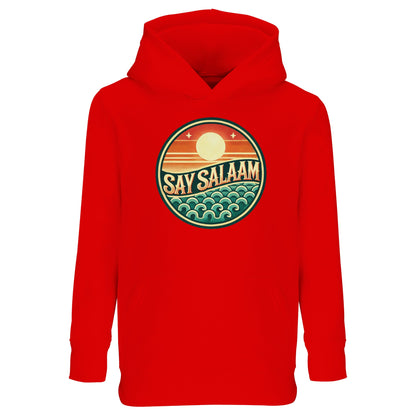 Say Salaam Sunset Glow Part-Recycled Cotton-Poly Kids Hoodie in Bright Red, a bold scarlet tone comparable to Rosso Corsa racing red. The retro sunset badge contrasts vividly against the red base, combining layered horizon graphics and ocean-inspired wave patterns. Made from a cotton and recycled polyester blend with brushed fleece lining for cooler weather comfort. Relaxed fit for active movement, ideal for football culture, weekend wear and expressive modest kids fashion.