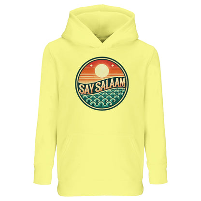 Say Salaam Sunset Glow Part-Recycled Cotton-Poly Kids Hoodie in Light Yellow, a soft pastel tone similar to lemon chiffon with sunny brightness. The circular sunset badge radiates warmth against the light base, highlighting orange sun gradients and teal wave details. Made from a cotton and recycled polyester blend with brushed fleece interior for cooler days. A cheerful relaxed-fit hoodie for school, sport and faith-inspired children’s fashion.