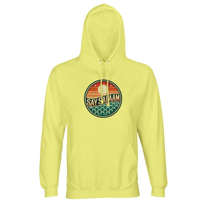Say Salaam Sunset Glow Part-Recycled Unisex Cotton-Poly Hoodie in Light Yellow, a soft pastel tone similar to lemon chiffon with gentle sunny brightness. The circular sunset badge stands out vividly against the pale base, combining warm sun gradients and cool ocean wave graphics. Constructed from 80% cotton and 20% recycled polyester, GRS certified, with brushed fleece interior and durable 280gsm weight. Ideal for football culture, youth styling and modest everyday wear.