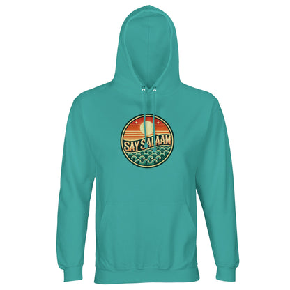 Say Salaam Sunset Glow Part-Recycled Unisex Cotton-Poly Hoodie in pool blue, a fresh aquatic tone similar to light sea green with cool coastal undertones. The circular sunset badge enhances the ocean theme, combining horizon stripes and stylised waves in retro colour layers. Constructed from 80% cotton and 20% recycled polyester with brushed fleece lining and 280gsm structure. A relaxed unisex hooded sweatshirt perfect for football supporters and modest lifestyle wear.
