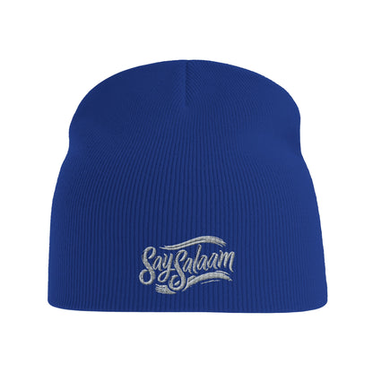 Say Salaam Classic Recycled Beanie Hat – Bright Royal / Lapis Blue with white logo. A winter hat / soft Muslim-type modest, ethical fashion wooly hat. An rPET-made alternative to a taqiyah, kufi or topi, this simple prayer-ready knit is one of the hats Muslims wear for warmth, faith and style or being Islamic. Great for salah, bad hair days or cold heads. Beenie, beany, beeny – however you write it, this is a basic streetwear essential for men in winter, or ladies, who google hats and say assalamalaikum.
