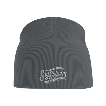 Say Salaam Classic Recycled Beanie Hat – Graphite Grey / Davy Grey with white logo. A winter hat / soft Muslim-type modest, ethical fashion wooly hat. An rPET-made alternative to a taqiyah, kufi or topi, this simple prayer-ready knit is one of the hats Muslims wear for warmth, faith and style or being Islamic. Great for salah, bad hair days or cold heads. Beenie, beany, beeny – however you write it, this is a basic streetwear essential for men in winter, or ladies, who google hats and say salam alaikum.