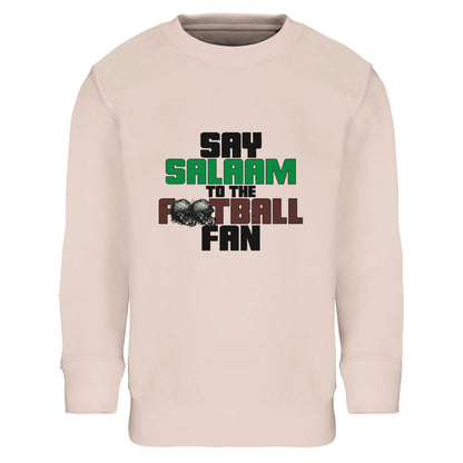 Say Salaam to the American Football Fan Original Part-Recycled Cotton-Poly Kids Sweatshirt – Creamy Pink / Oyster Pink featuring bold, text-based design in Black, La Salle Green and American Football Leather Brown — with sketch-style helmets for a gritty, gridiron-inspired twist. A faith-friendly, sustainable jumper that channels raw Sunday-night energy. For NFL-loving kids who treat it like a jersey, track touchdowns, rep their favourite teams, and scroll highlights between prayer times.