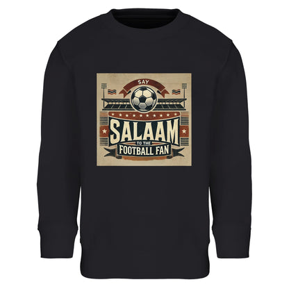 Say Salaam to the Football Fan Design #11 Part-Recycled Cotton-Poly Kids Sweatshirt – Black / Jet featuring bold vintage matchday art in tan and red with stadium banners, flags, and ‘Salaam’ print. A long sleeve fan jumper for boys, girls, or unisex youth who follow football drama from Saudi League clashes to Premier League and Champions League thrillers. Graphic sweatshirt, modest streetwear, football tee for Muslim or non-Muslim supporters in love with the Beautiful Game, cheering Lyon, Ajax, PSG, etc.