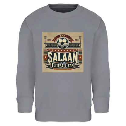 Say Salaam to the Football Fan Design #11 Part-Recycled Cotton-Poly Kids Sweatshirt – Grey Melange / Classic Athletic Grey featuring matchday crowd art in tan, red and black with stadium, flags and ‘Salaam’ across the chest. Graphic pullover sweatshirt for young fans of football history, VAR debates and kit obsessions – whether it’s Premier League, UCL or Saudi League. Boys’ or girls’ long sleeve fan top, children’s streetwear, modest sportswear to stream the match and watch Ronaldo, Messi and Mbappe, etc.
