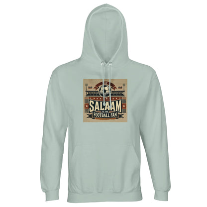 Say Salaam to the Football Fan Design #11 Part-Recycled Unisex Cotton-Poly Hoodie – Creamy Green / Greenish Grey featuring vintage matchday artwork in muted tan, black, and red tones with a stadium scene, bold ‘Salaam’ lettering, flags, and a matchball. A classic pullover hoodie for true supporters who track Premier League tables, Champions League goals, and Saudi Pro League transfers. Modest streetwear meets football fan gear – the sweatshirt for streaming matches or catching them live.