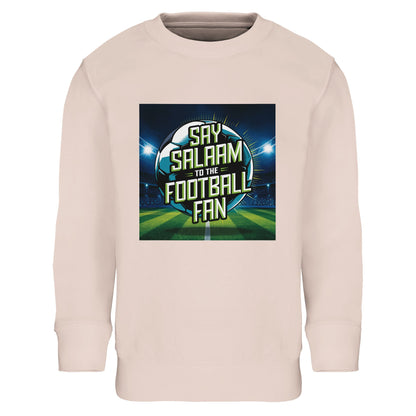 Creamy Pink / Oyster Pink Say Salaam to the Football Fan Design #2 kids sweatshirt pairing a soft pastel base with a vibrant football stadium scene and central Salaam text. Designed for young Muslim football fans who enjoy gentler tones, this modest apparel piece blends Islamic clothing sensibilities with sport-inspired visuals for daily wear, playtime, and family match traditions.