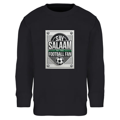 Black / Deep Black / Zeus Say Salaam to the Football Fan Design #3 kids sweatshirt featuring a bold monochrome football poster-style print with strong block typography and Salaam lettering centred on the chest. The structured graphic references classic matchday programmes and retro football signage. Made from a cotton-polyester blend with brushed fleece lining, this sweatshirt offers warmth, durability, and a good price. A practical choice for Muslim clothing, modest wear, and Islamic shop collections.