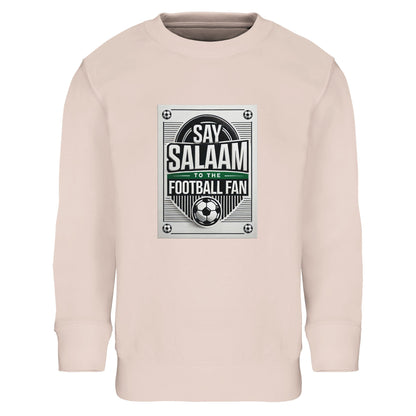 Creamy Pink / Oyster Pink Say Salaam to the Football Fan Design #3 kids sweatshirt offering a soft pastel alternative while keeping the bold football poster print and Salaam lettering central and visible. The design balances playful colour with structured football graphics. Crafted with brushed fleece lining and a cotton-poly blend, this affordable long-sleeve sweatshirt suits modest Muslim clothing ranges and Islamic shop assortments aimed at younger fans.