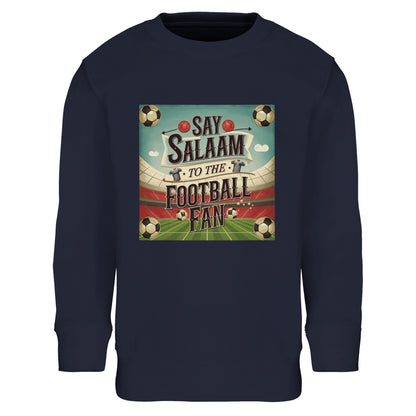 Say Salaam to the Football Fan Design #5 kids sweatshirt in French Navy / Ebony Clay, pairing deep, classic tones with heritage football artwork inspired by traditional match graphics. Ribbed cuffs and hem create a snug fit, while the brushed fleece interior keeps young fans warm on cool days. A versatile and well-priced Muslim kids football sweater suitable for everyday wear, offering durable fabric, easy maintenance, and a timeless colour that works well for school, casual outfits, and regular matchdays.