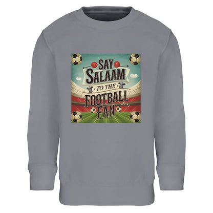 Say Salaam to the Football Fan Design #5 kids sweatshirt in Grey Melange / Heather Grey / Marl Grey / Classic Athletic Grey Blend, delivering a sporty neutral look inspired by traditional football training wear. Crafted with a soft fleece lining for added Islamic warmth, this jumper suits active kids and everyday football fans alike. A practical and affordable sweatshirt that blends Muslim football culture with comfort, durability, and easy styling for year-round casual wear at school, home, or outdoor play