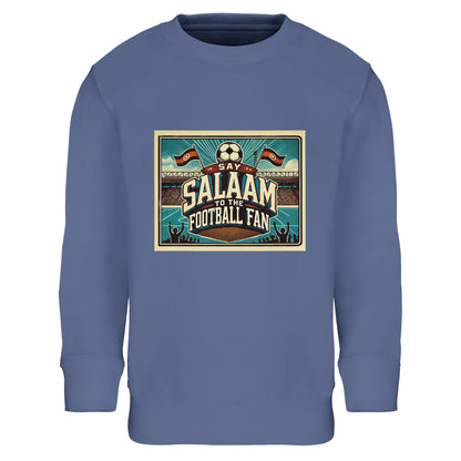 Say Salaam to the Football Fan Design #7 kids sweatshirt in Blue / Marble Blue / Blue-Grey / Waikawa Grey, showcasing a vintage football stadium design with flags, pitch detail and bold lettering. Crafted from a cotton and recycled polyester blend, this cosy sweatshirt suits school routines, playground football and match-night viewing. A modest, well-priced kids football sweatshirt for ages 4–14, offering soft comfort, durability and affordable everyday wear.