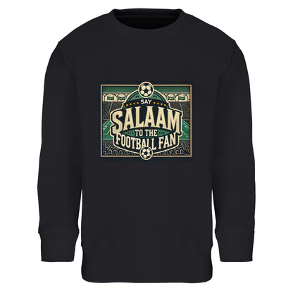 Say Salaam to the Football Fan Design #8 kids sweatshirt – Black / Deep Black / Zeus with bold block lettering surrounded by illustrated footballs, cheering crowds, stadium terraces and pitch lines. The dark base gives the artwork a strong match-night feel, ideal for young fans who live for football culture and modest, comfortable clothing. Designed for ages four to 14, great for school, outdoor play, cold matchdays, or watching games at home. A striking football jumper that carries energy and Salaam.
