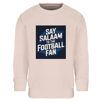 Creamy Pink Say Salaam to the Football Fan kids sweatshirt combining soft colour with bold football attitude. Made from a comfortable cotton-poly blend including recycled polyester, this sweatshirt suits children aged 3-16. Ideal for young football fans supporting a team or FC, enjoying matches at home, or wearing everyday streetwear. Designed as modest Muslim kids wear that balances sport, faith, and style. A strong choice for new childrens fanwear, gifts, and affordable football clothing to say Salaam.