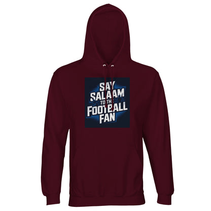 Say Salaam to the Football Fan Design #9 Part-Recycled Unisex Cotton-Poly Hoodie – Burgundy / Dark Sienna with cream football text in a shadowed square. A modest unisex brushed-fleece hooded pullover. Not the replica kit — this warm, steady layer suits supporters walking home from matches, catching replays after prayers, discussing weekend fixtures, reviewing tables, studying Champions League results and keeping football alive in daily routine, training nights and cold terraces.