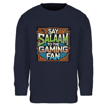French Navy / Ebony Clay youngsters’ sweatshirt featuring the Say Salaam to the Gaming Fan design in a vibrant retro arcade frame with vintage typography. A brushed fleece cotton-poly blend long-sleeve top for children competing in ranked matches, FIFA tournaments, Call of Duty sessions and esports leagues. A modest, durable sweatshirt for boys and girls combining gaming ambition with identity, confidence and positive online community spirit.