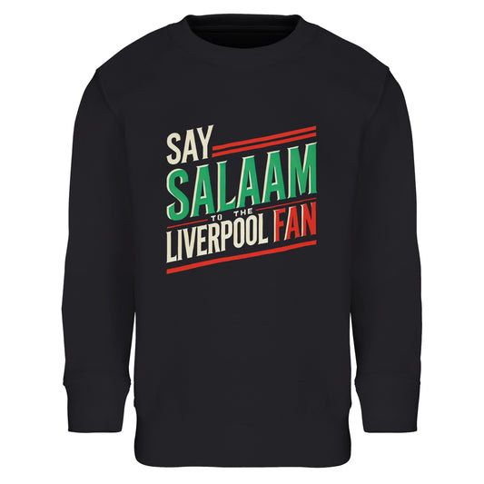 Say Salaam to the Liverpool Fan Design #1 Part-Recycled Cotton-Poly Kids Sweatshirt – Black / Deep Black featuring bold retro typography in green, cream, and red. The design captures football pride and faith in one clean graphic that reads ‘Say Salaam to the Liverpool Fan’. Made from an 80% cotton, 20% recycled polyester blend with soft brushed fleece lining, this kids’ jumper brings together modest comfort, sustainability, and Scouse energy — ideal for matchday layering or quiet prayer evenings.