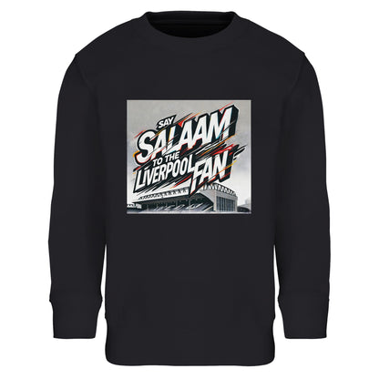 Say Salaam to the Liverpool Fan Design #2 Part-Recycled Cotton-Poly Kids Sweatshirt – Black / Onyx featuring dynamic graffiti-style lettering bursting across an illustrated Anfield Stadium. White, red, and gold brushstrokes evoke motion and crowd energy. Made from an eco-friendly 80/20 cotton-poly blend with brushed fleece lining, it’s soft, durable, and warm. Designed for young Liverpool fans who live their faith proudly while cheering under floodlights, between prayers, and at home.