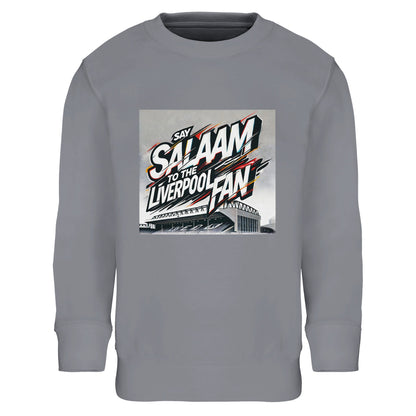 Say Salaam to the Liverpool Fan Design #2 Part-Recycled Cotton-Poly Kids Sweatshirt – Grey Melange / Stadium Ash featuring stylised graffiti text across an etched Anfield stadium scene. The layered white and red strokes bring street-art realism to football culture. Made from soft, planet-friendly brushed cotton-poly fleece, it combines comfort with conscience. A standout Liverpool kids’ sweatshirt for fans who know that Salaam means both peace and pride in every goal.