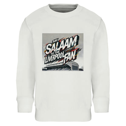 Say Salaam to the Liverpool Fan Design #2 Part-Recycled Cotton-Poly Kids Sweatshirt – White / Classic Chalk featuring graffiti text slashed across Anfield’s outline in black, red, and gold. Sleek, clean, and full of motion, the design embodies both elegance and excitement. Made from brushed fleece cotton-poly blend, it’s soft, warm, and sustainably built. A versatile piece for Liverpool kids who live by peace and play — balancing prayer, passion, and Premier League pride.
