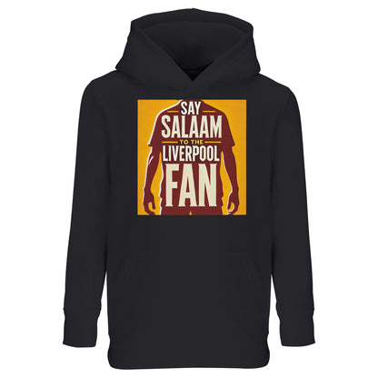 Say Salaam to the Liverpool Fan Design #3 Part-Recycled Cotton-Poly Kids Hoodie – Black / Onyx featuring a bold burgundy silhouette of a Liverpool player standing tall beneath golden text that reads ‘Say Salaam to the Liverpool Fan’. The graphic radiates pride and faith, resembling a badge of honour. Made from a soft, eco-friendly brushed fleece cotton-poly blend, it delivers comfort, durability, and warmth for every young supporter who cheers, prays, and dreams of Anfield.