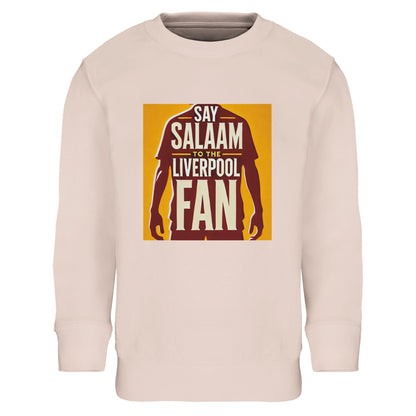 Say Salaam to the Liverpool Fan Design #3 Kids Sweatshirt – Creamy Pink / Soft Blush featuring a deep red silhouette outlined within a golden background. Crafted from a cosy part-recycled cotton blend, this sweatshirt captures the calm confidence that defines Salah — on the pitch and in faith. A comfortable, modest piece for young Muslim football fans who wear their Salaam proudly, echoing Liverpool’s anthem and Salah’s quiet power in one meaningful design.