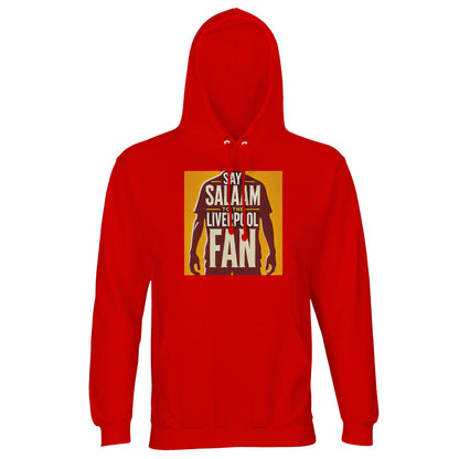 Say Salaam to the Liverpool Fan Design #3 Part-Recycled Unisex Cotton-Poly Hoodie – Bright Red / Anfield Scarlet featuring bold gold artwork of a footballer silhouette with proud typography spelling ‘Liverpool Fan’. Crafted from brushed cotton-poly fleece for warmth and comfort, it celebrates the intersection of faith, football, and friendship. A statement piece for those who cheer with conviction and live the values of respect, humility, and unity — both on and off the pitch.