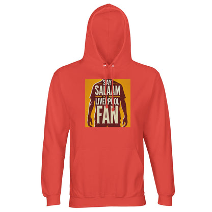 Say Salaam to the Liverpool Fan Design #3 Part-Recycled Unisex Cotton-Poly Hoodie – Pop Orange / Matchday Glow featuring deep red text and a silhouetted player on a gold field. Made from a sustainable cotton-poly blend for lasting comfort, this hoodie pairs Liverpool vibrance with the universal greeting of peace. Whether in prayer or in the stands, fans can wear this as a statement of unity — bridging cultures through the shared language of sport and Salaam.