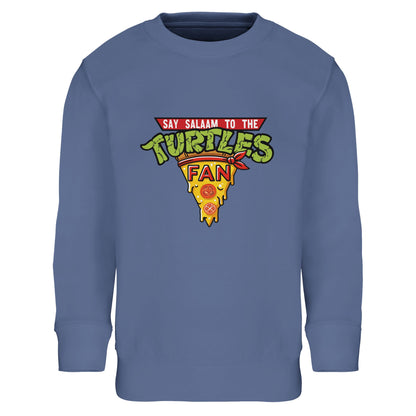 Say Salaam to the Turtles Fan Pizza Design #1 Part-Recycled Cotton-Poly Kids Sweatshirt – Blue / Royal Sky showing the famous TMNT crest. A Nickelodeon Teenage Mutant Ninja Turtles movie-inspired sweatshirt that brings back 90s nostalgia and the teamwork of Leonardo, Donatello, Michelangelo, Raphael, Splinter, April and Venus de Milo. Not the Primark TMNT Pizza Hut jumper — this modest, low priced brushed fleece is soft, unisex and perfect for youngsters who love pizza nights, comics and fun green heroes.
