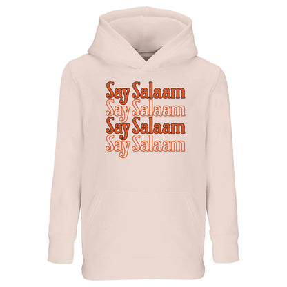 Creamy Pink / Oyster Pink kids hoodie showcasing the Say Salaam 4-Line stacked chest design in warm orange lettering. Four repeated Salaam lines form a neat vertical block graphic with soft retro tone and balanced spacing. Gentle pink base complements the warm typography, creating calm yet confident visual harmony. Finished with brushed fleece comfort, this modest hoodie suits Muslim boys and girls bringing peaceful greeting culture into school, sports and family life.