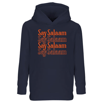 French Navy / Ebony Clay kids hoodie with Say Salaam 4-Line stacked typographic design in warm orange tones. Four repeated lines form a structured central block graphic, creating depth and symmetry against the deep navy base. The contrast delivers a classic retro sport aesthetic with modern modest identity. Brushed fleece interior supports comfort and warmth, ideal for cooler match days, mosque visits and everyday Muslim youth street style grounded in positive greeting culture.