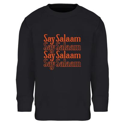 Say Salaam 4-Line Part-Recycled Cotton-Poly Kids Sweatshirt – Black / Deep Black. Islamic youth sweatshirt featuring a stacked four-line “Say Salaam” graphic in warm orange hues. The horizontal repetition forms a structured block layout with strong symmetry and vintage-inspired typography. High contrast against the black base creates a bold, night-time streetwear aesthetic, delivering confident Muslim messaging in a clean, modern format.