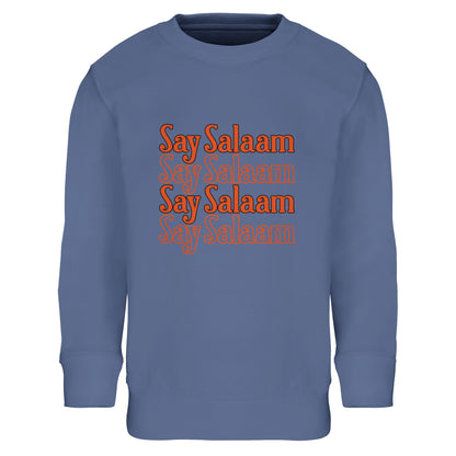 Say Salaam 4-Line Part-Recycled Cotton-Poly Kids Sweatshirt – Blue / Denim Blue. Kids Muslim sweatshirt displaying a four-row stacked “Say Salaam” print in rich orange lettering. The repeated horizontal layout creates strong visual balance and rhythm, forming a compact rectangular design across the chest. Cool blue background contrasts with the warm text tones, giving a bold, modern streetwear vibe inspired by classic graphic tees and youth culture in a cheap, high quality jumper.
