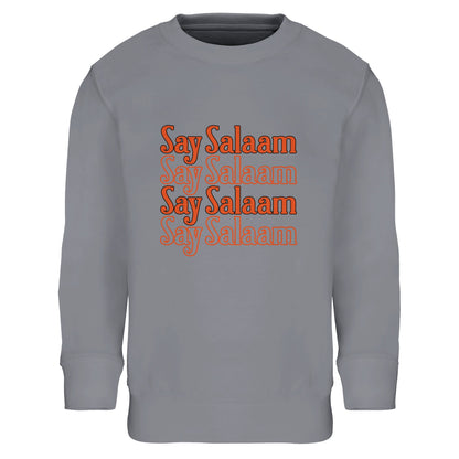 Say Salaam 4-Line Part-Recycled Cotton-Poly Kids Sweatshirt – Grey Melange / Heather Grey. Islamic youth sweatshirt featuring a structured four-line stacked “Say Salaam” graphic in burnt orange tones. The clean horizontal repetition forms a rectangular text block with a subtle retro aesthetic. Athletic grey base enhances the sporty, everyday feel while the layered typography adds depth and warmth. A simple yet bold design rooted in Muslim identity and positive messaging in a cheap, high quality jumper.