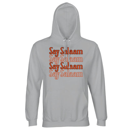 Ash / Silver Chalice unisex hoodie showcasing the Say Salaam 4-Line stacked chest print in rich orange typography. The soft light grey base gives subtle texture, allowing the four-line block graphic to stand out with balanced depth and warmth. Clean vertical alignment and retro tone create understated impact. Finished with brushed fleece lining and lined hood, this hoodie blends classic athletic mood with confident Islamic greeting culture.