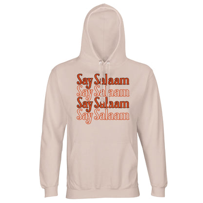 Creamy Pink / Oyster Pink unisex hoodie featuring the Say Salaam 4-Line repeated typographic design in deep orange lettering. The soft blush base harmonises with the warm graphic tone, creating smooth contrast and vintage-inspired layering. Four stacked Salaam lines build structured central focus while maintaining relaxed aesthetic. Brushed fleece interior and durable weight make this hoodie ideal for expressive modest wear across seasons.