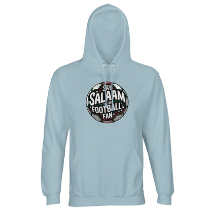 Creamy Blue Islamic unisex hoodie featuring the Say Salaam to the Football Fan Design #1 circular football emblem. The design centres on a bold round badge with dark charcoal pitch tones, white and green lettering and a subtle halo of stadium light effects that give depth and dimension. The circular shape mirrors traditional football crests while the overall tone remains fresh and contemporary. Muslim football fan streetwear for matchdays, mosque youth leagues and community tournaments.