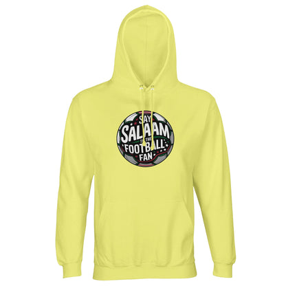 Light Yellow / Lemon Chiffon Islamic unisex hoodie featuring the Say Salaam to the Football Fan Design #1 round badge artwork. The circular football crest silhouette is framed by a stadium glow effect with dark charcoal, forest green and white lettering set across a pitch-inspired background. The bold circular form echoes traditional club badges while the tone feels modern and uplifting. Muslim football fan clothing for young supporters and players who combine salaam greetings with matchday passion.