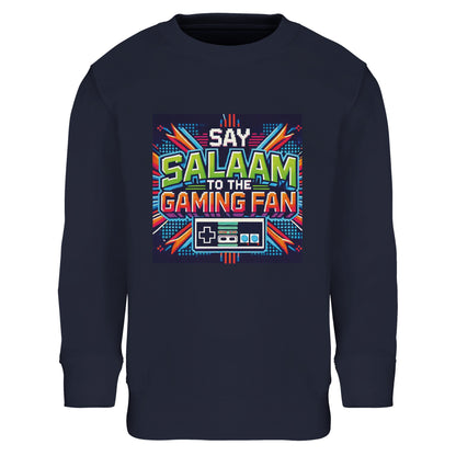 French Navy / Ebony Clay Islamic kids sweatshirt featuring Say Salaam to the Gaming Fan Design #2 graphic. Muslim gamer clothing made from an 80% cotton and 20% recycled polyester blend with brushed fleece interior for a soft, structured feel. Sustainable modest streetwear for esports tournaments, school tech clubs, console sessions and community youth programmes. Built for comfort and resilience, uniting Islamic values and gaming culture for young digital competitors.