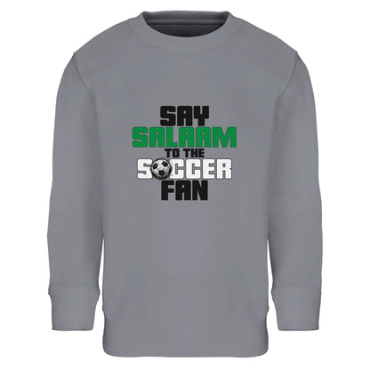 Say Salaam to the Soccer Fan Original Part-Recycled Cotton-Poly Kids Sweatshirt – Grey Melange / Heather Grey. Youth Islamic soccer sweatshirt featuring a structured block-text design with black and green lettering arranged in a vertical stack. The clean alignment and subtle football icon create a modern sportswear aesthetic inspired by academy kits and club merchandise. Athletic grey base reinforces the training-ground tone, blending Muslim streetwear with everyday football culture.