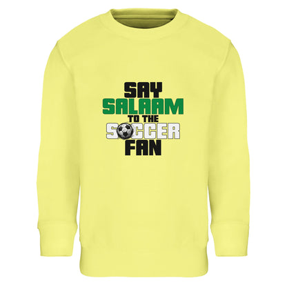 Say Salaam to the Soccer Fan Original Part-Recycled Cotton-Poly Kids Sweatshirt – Light Yellow / Lemon. Youth Muslim soccer sweatshirt featuring bold stacked block lettering in black and green with a small football motif. The vertical composition keeps the message punchy and clear, creating a lively, energetic mood. Bright yellow base amplifies the playful, summer-tournament vibe while maintaining a strong football identity rooted in Islamic greeting culture.