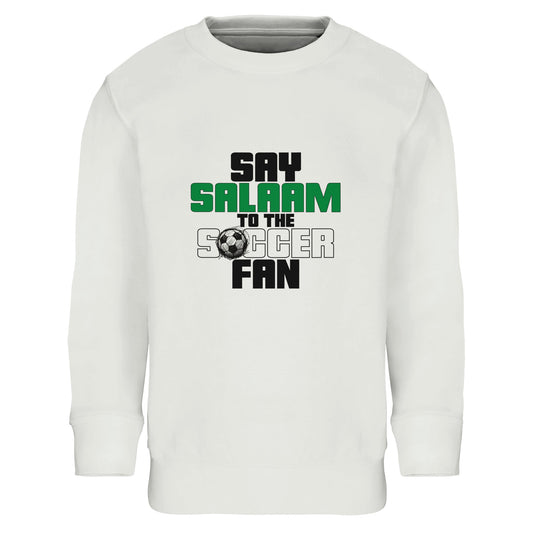 Say Salaam to the Soccer Fan Original Part-Recycled Cotton-Poly Kids Sweatshirt – White / Platinum. Kids Islamic soccer sweatshirt featuring a bold stacked typographic graphic centred on the chest. The design uses strong block lettering in black and deep green with a small football icon. “Say Salaam” appears prominently above “Soccer Fan” in a clean vertical composition, creating a modern streetwear feel. Crisp contrast against the white base gives it a sharp, confident tone for playgrounds.