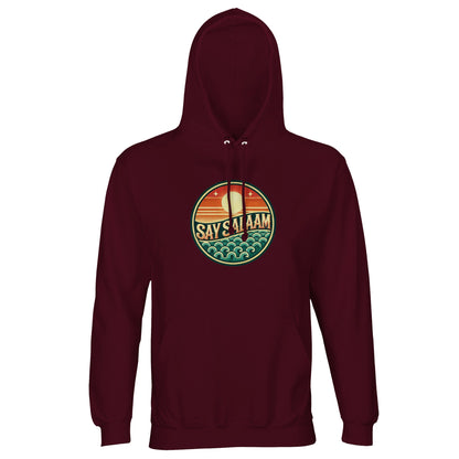 Burgundy / Dark Sienna unisex hoodie displaying the Say Salaam Sunset Glow circular horizon emblem in rich sunset gradient tones. The deep burgundy base complements the warmth of the badge, creating harmonious contrast and refined streetwear character. The round skyline composition delivers structured central symmetry and bold SAY SALAAM focus. Ideal for modest Muslim fashion, this hoodie blends comfort, Islamic identity and expressive urban styling.