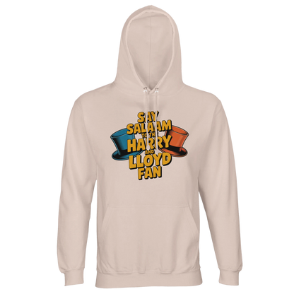 Creamy Pink / Oyster Pink unisex cotton-poly hoodie with the Say Salaam to the Harry and Lloyd Fan artwork inspired by Dumb and Dumber. Highlighting the cult status of Jim Carrey and Jeff Daniels’ legendary duo, from the suitcase of ransom cash to slapstick chaos, this hooded sweatshirt merges comedy nostalgia with modest Muslim streetwear. Soft fleece interior, substantial weight and relaxed unisex fit ideal for movie marathons and fan conventions.