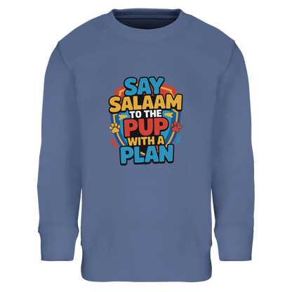Say Salaam to the Pup with a Plan Part-Recycled Cotton-Poly Kids Sweatshirt (Blue / Marble Blue / Blue-Grey / Waikawa Grey). Kids jumper featuring a colourful square illustration panel and a slogan printed across the chest. The playful graphic blends bold cartoon lettering with a lively rescue-pup style illustration inspired by adventurous animated puppy teams loved by Paw Patrol fans. Soft cotton-poly fleece with recycled fibres provides warmth and durability for everyday clothing. 