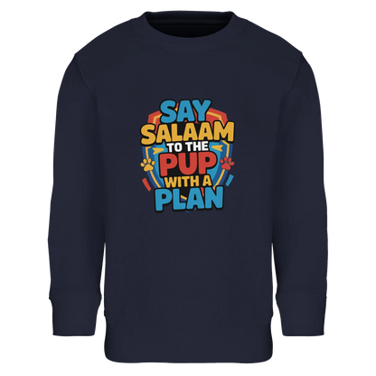 Say Salaam to the Pup with a Plan Part-Recycled Cotton-Poly Kids Sweatshirt (French Navy / Ebony Clay). Kids jumper featuring a colourful square illustration panel and a slogan printed across the chest. The playful graphic blends bold cartoon lettering with a cheerful rescue-pup themed illustration inspired by animated puppy teams popular with Paw Patrol Movie fans. Soft cotton-poly fleece made partly with recycled fibres provides warmth & durability for Rubble, Ryder, Rocky, Skye & Chase everyday wear.